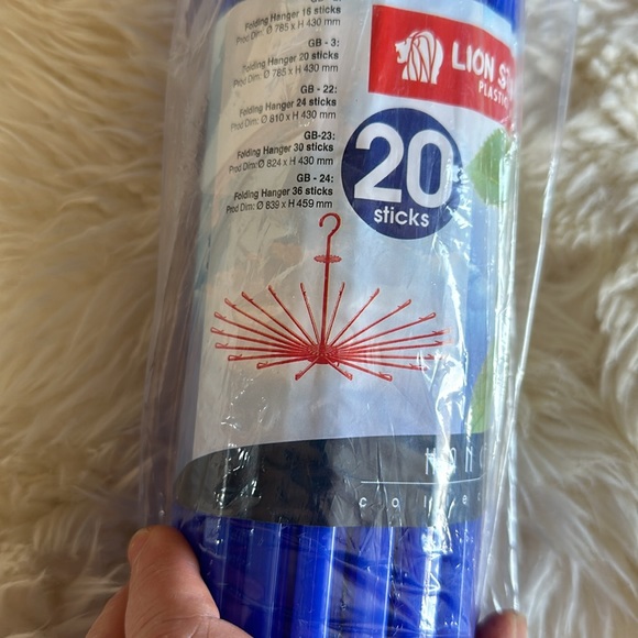 Bright blue hanging drying rack for clothes. Never opened. 17” long. Lightweight - Picture 6 of 7